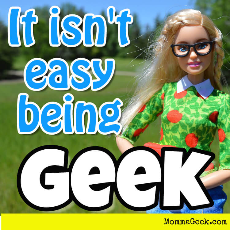 Barbie holding a book with geek glasses